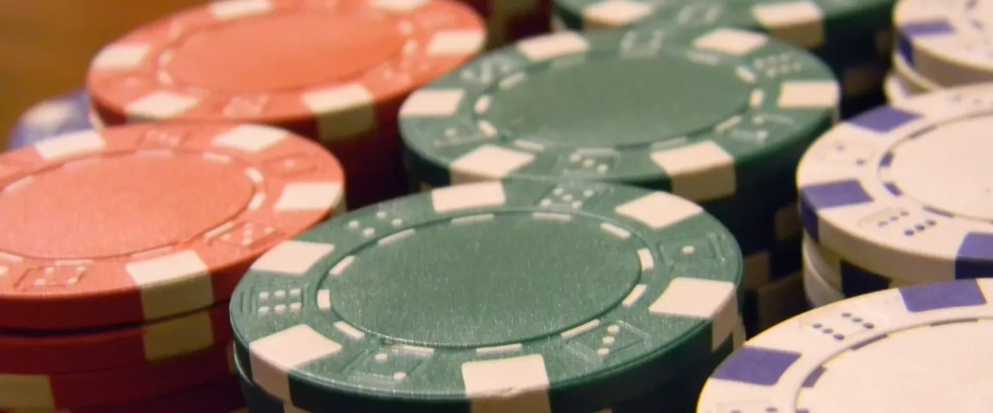 Close-up of stacked red, green and white poker chips